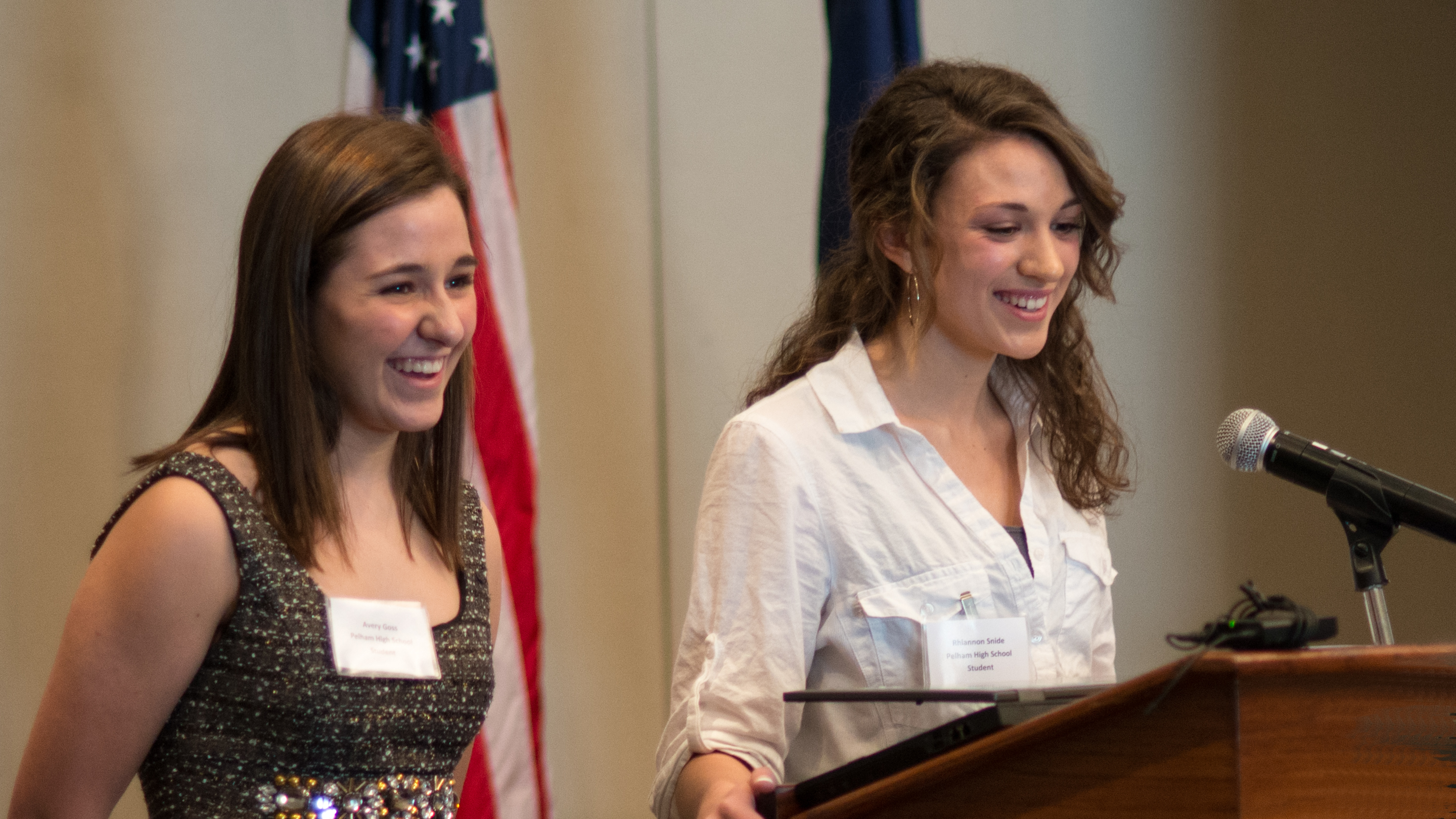 Avery Goss (left) and Rhiannon Snide (right) from Pelham High School, recount their experiences in this year’s WiT program during Tuesday’s ceremony.