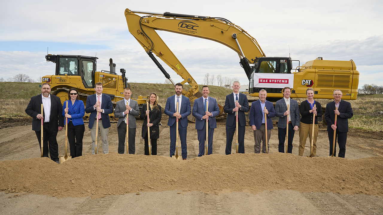 Senior leadership stand with shovels at Maple Grove's ground breaking