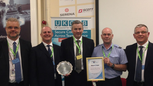 The winning team with their award,  left to right: Mike Johnson, Ian Haddleton, Graham Curtis (Presenter), Squadron Leader Steve Webster and Brian Smith