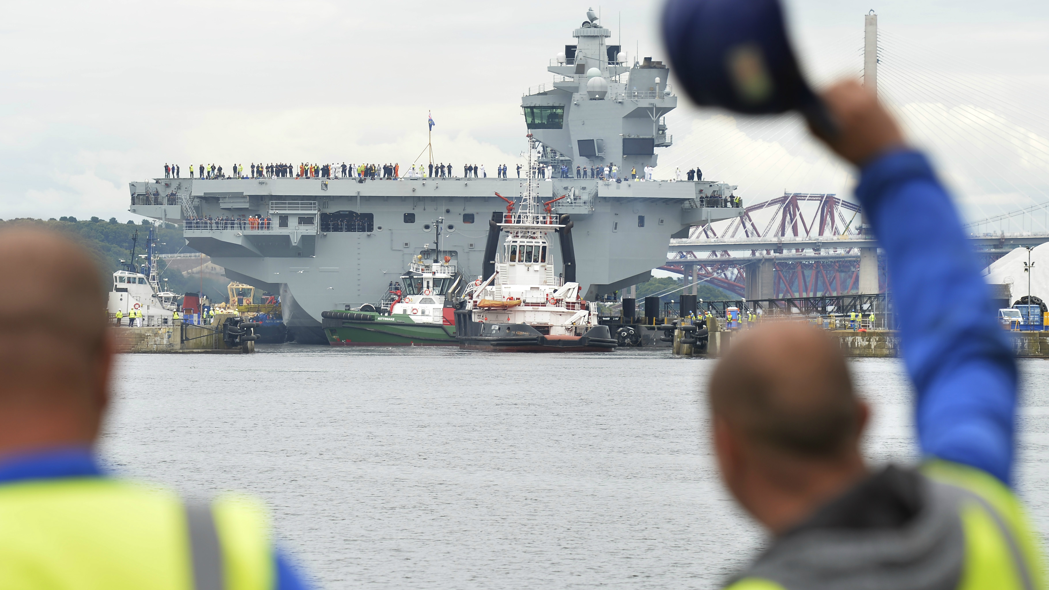 Image of employees waving goodbye to HMS Queen Elizabeth today
