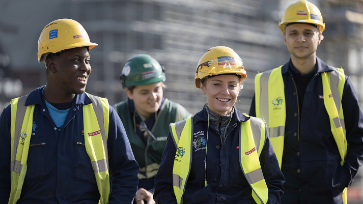 Four members of the BAE Systems engineering team standing together.