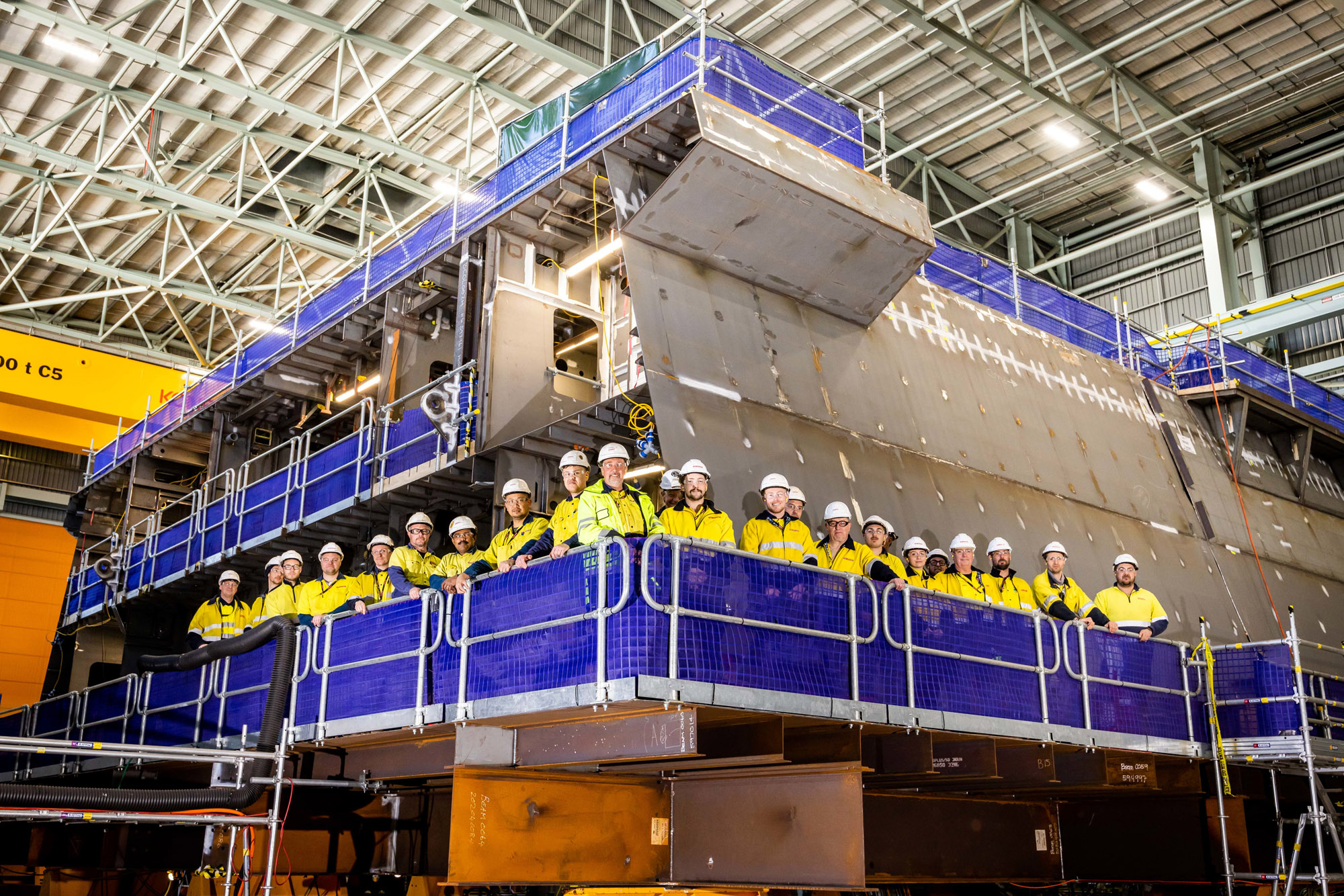 Beneath The Deck Podcast banner, photo of employees in front of a HCFP block