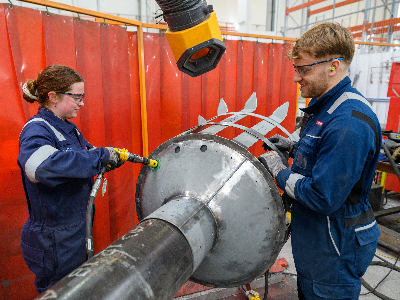 Two fabrication professionals at work for BAE Systems in Portsmouth Naval Base