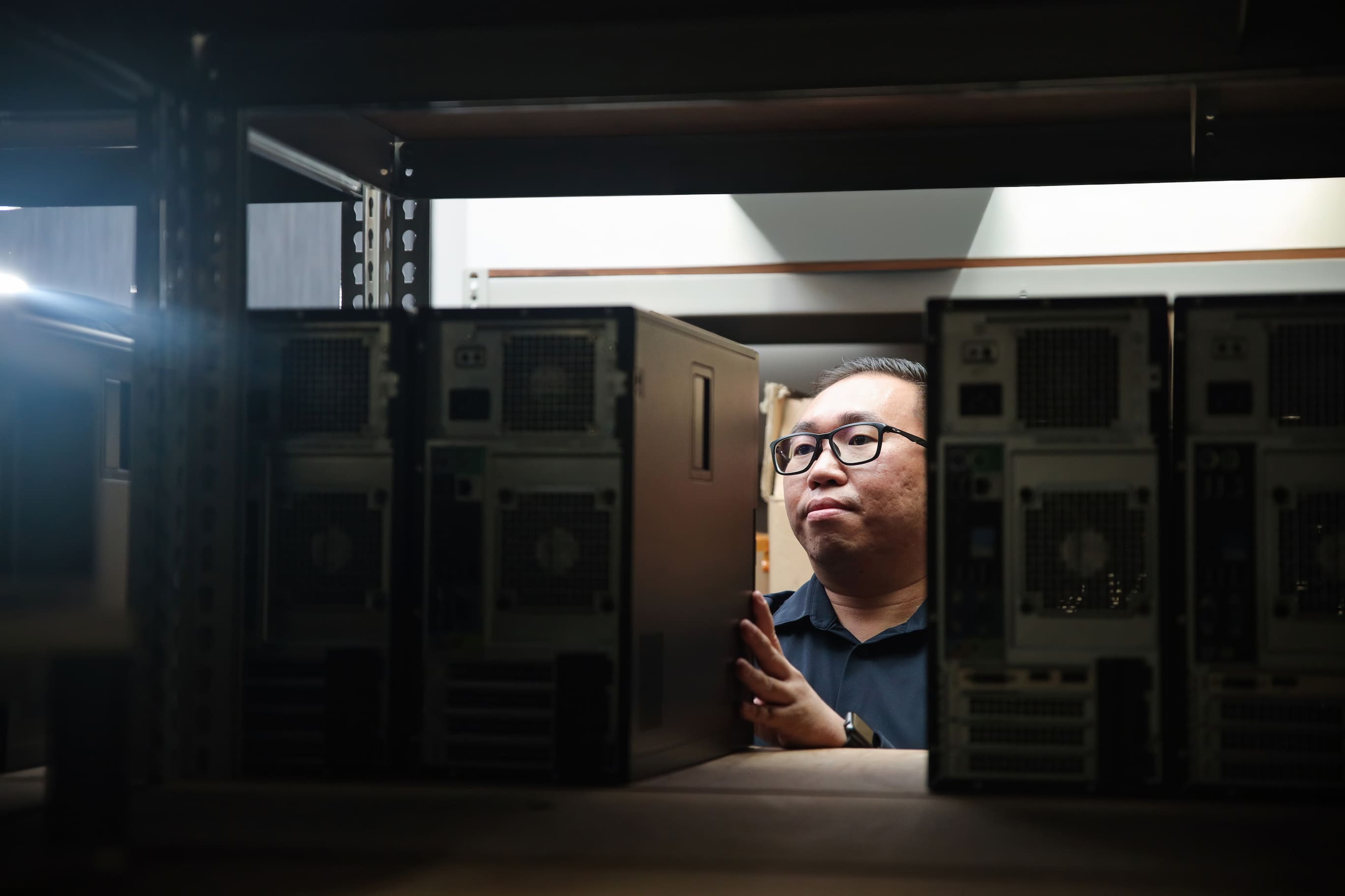 Man sorting computers