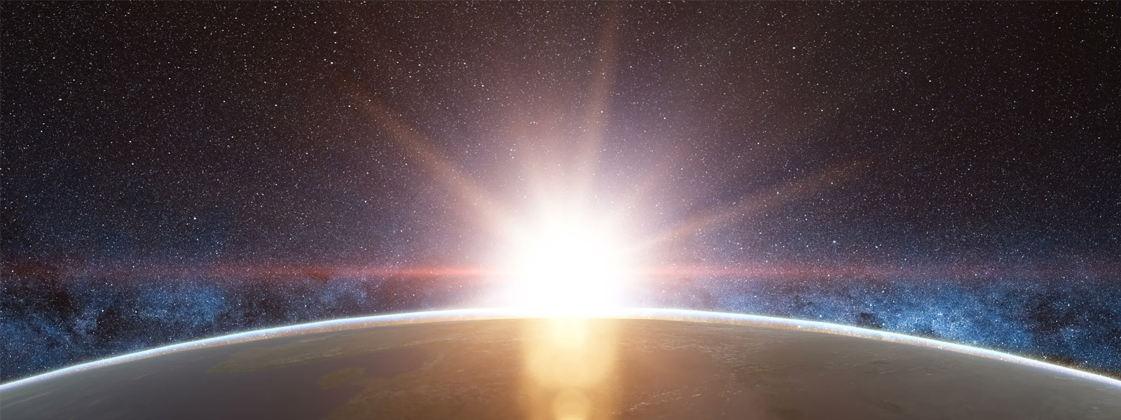 The Sun rising over the Earth as seen from space