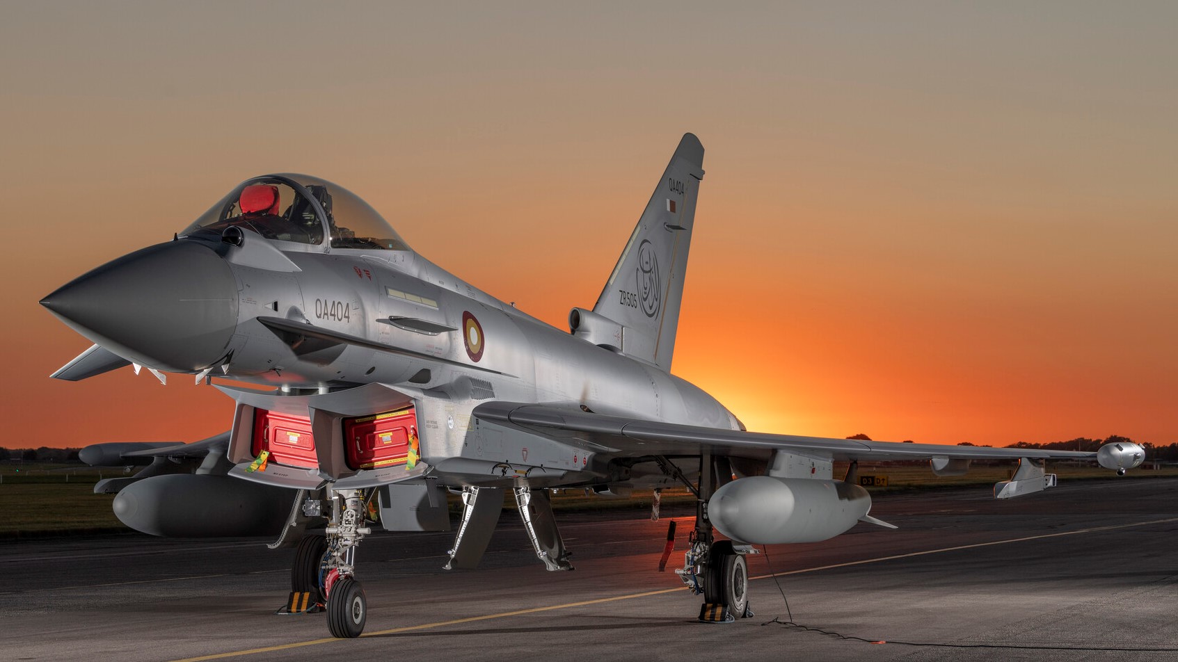Qatari Typhoon on runway with sunset in background