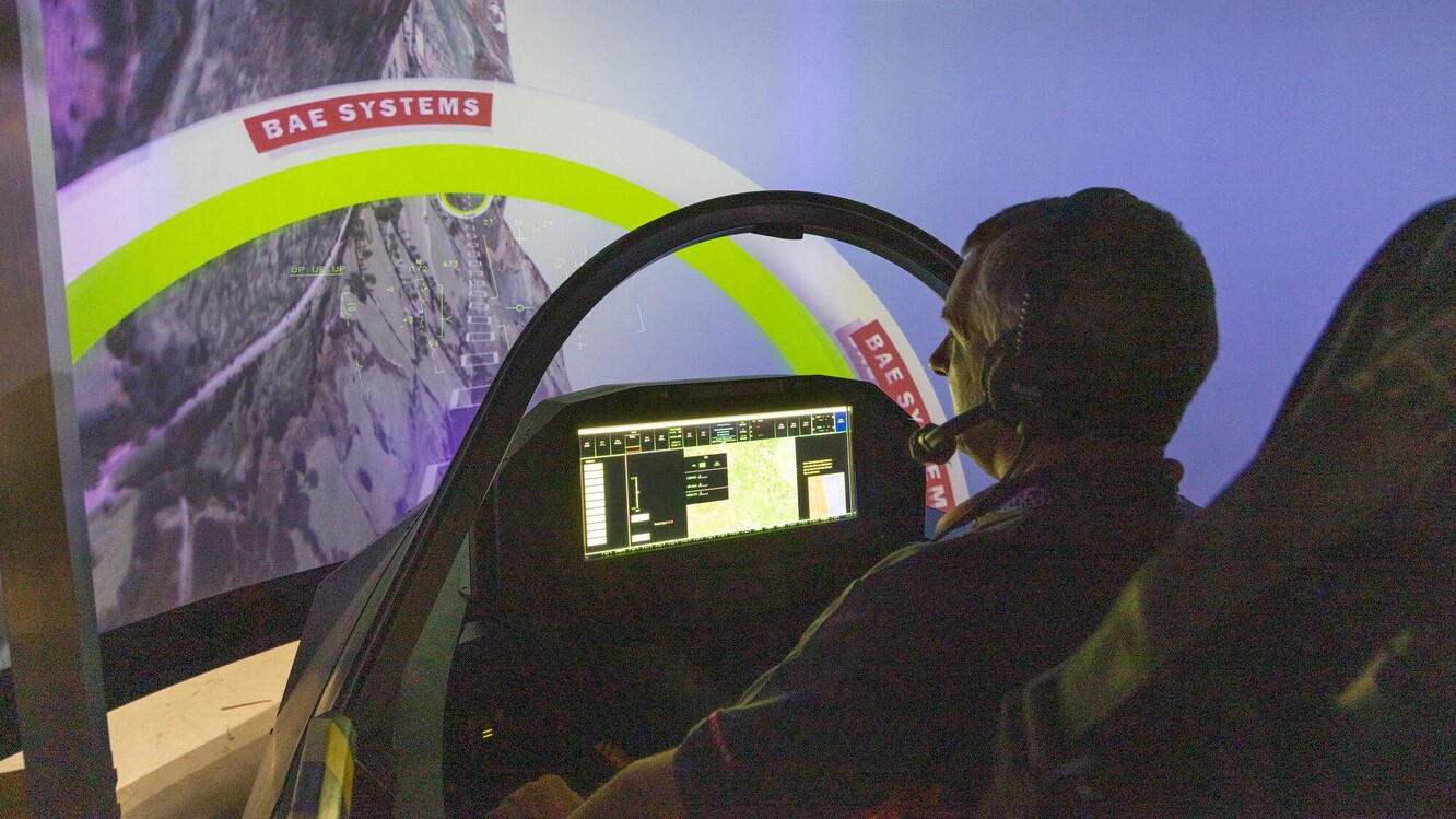Pilot in a simulator virtually flying an aircraft