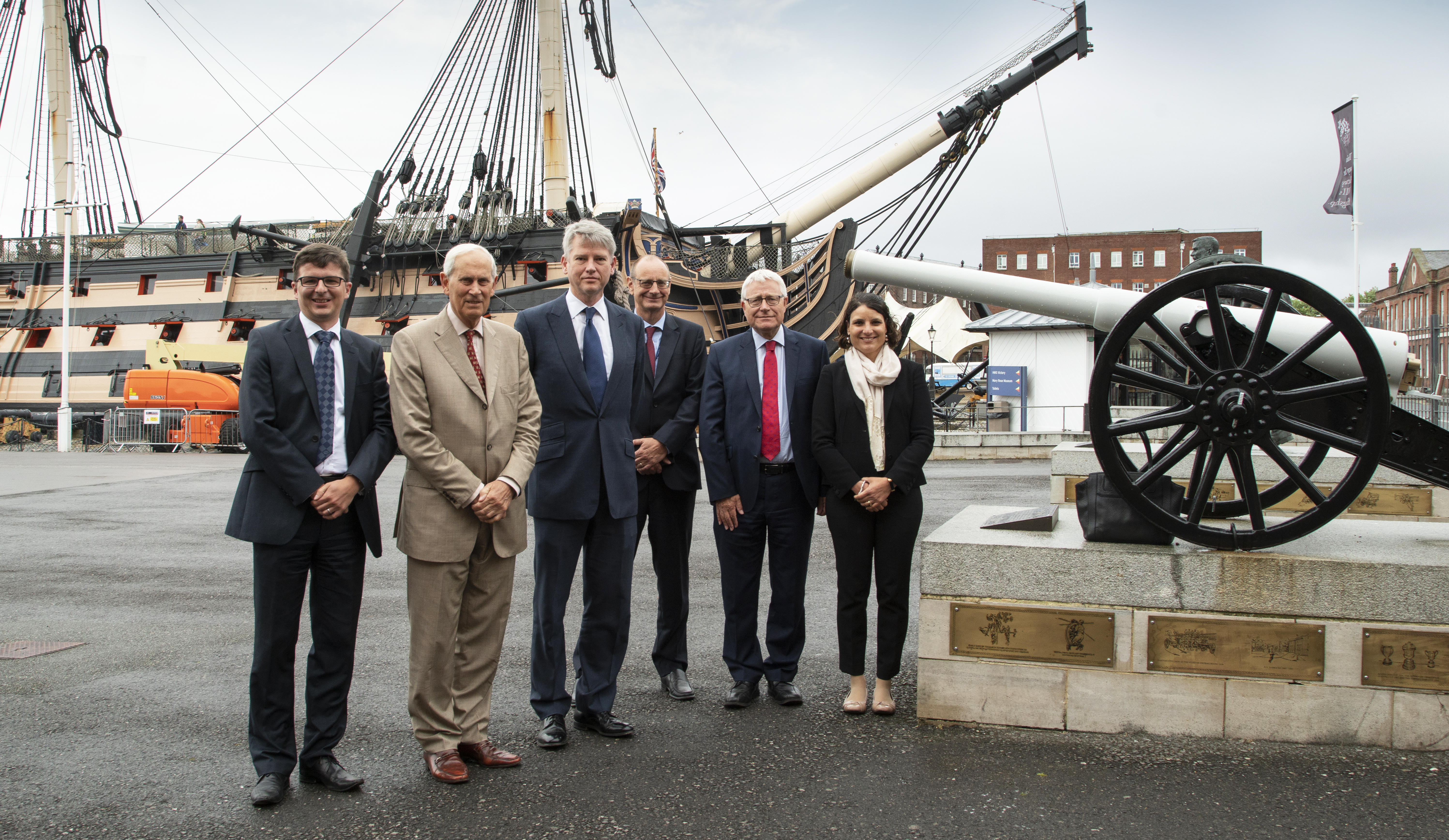 CEO Charles Woodburn in front of HMS Victory as part of NMRN collaboration