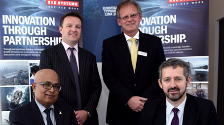 Manoj Narayanan of LOKA and John Brosnan of BAE Systems sign the agreement