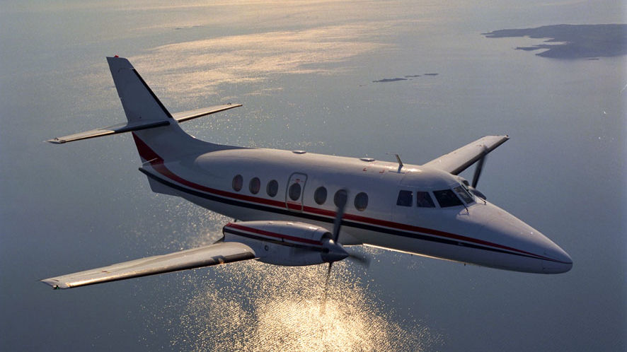 J31 flying in the air underneath a body of water