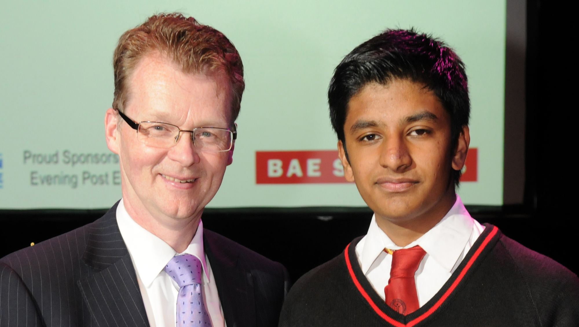 Ian Wood (left) presents the Young Scientist/Engineer Award to Nikhil Reji