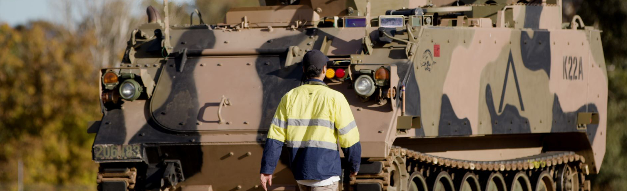 Man walks towards optionally crewed vehicle