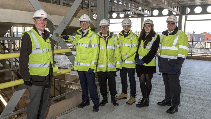 The team viewing the progress at the new training academy