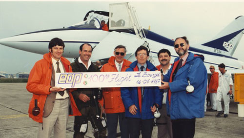 A celebration for the 100th EAP flight at Paris. Dave Ward 4th from the left.