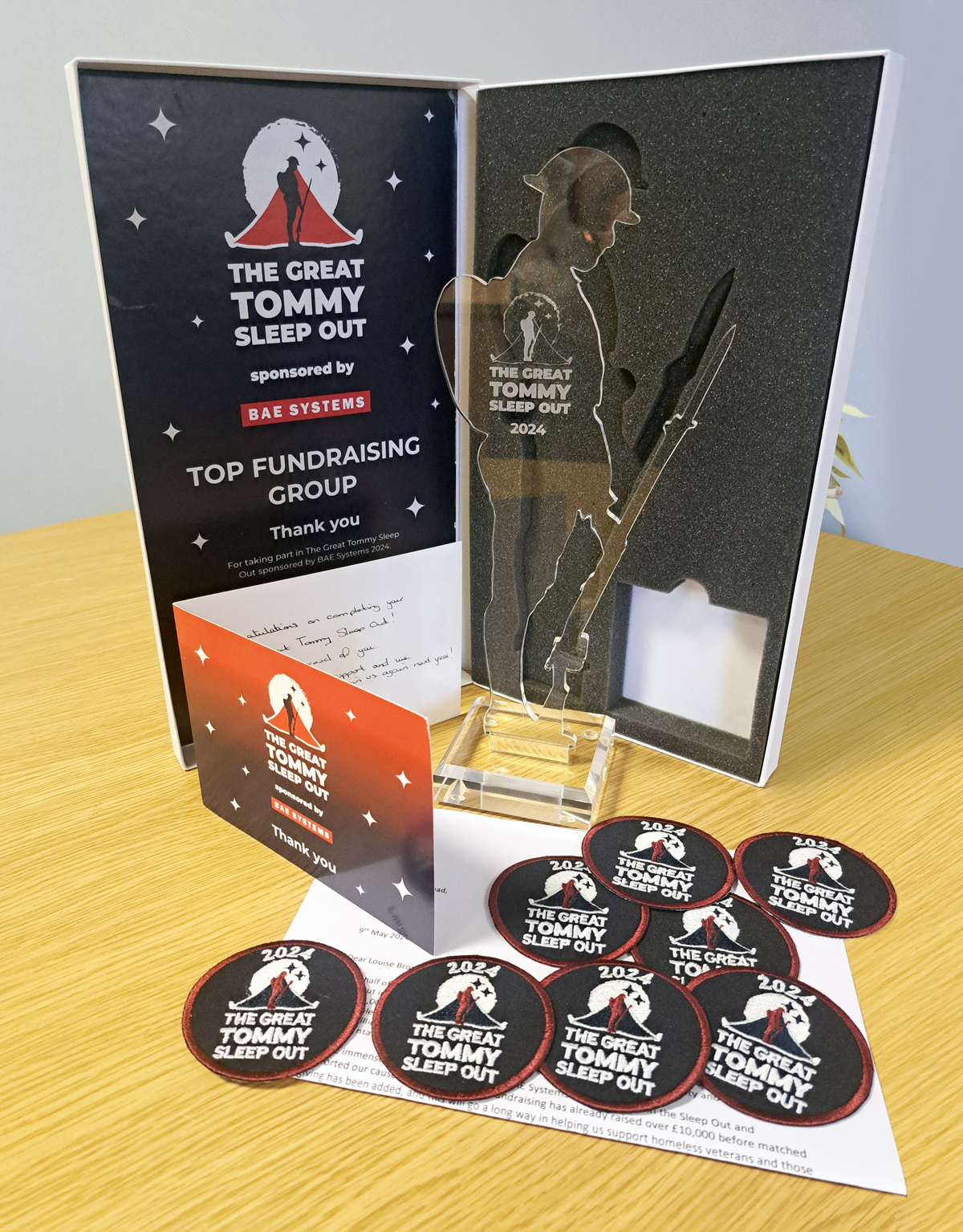 Image showing Louise's Great Tommy Sleep Out trophies on desk