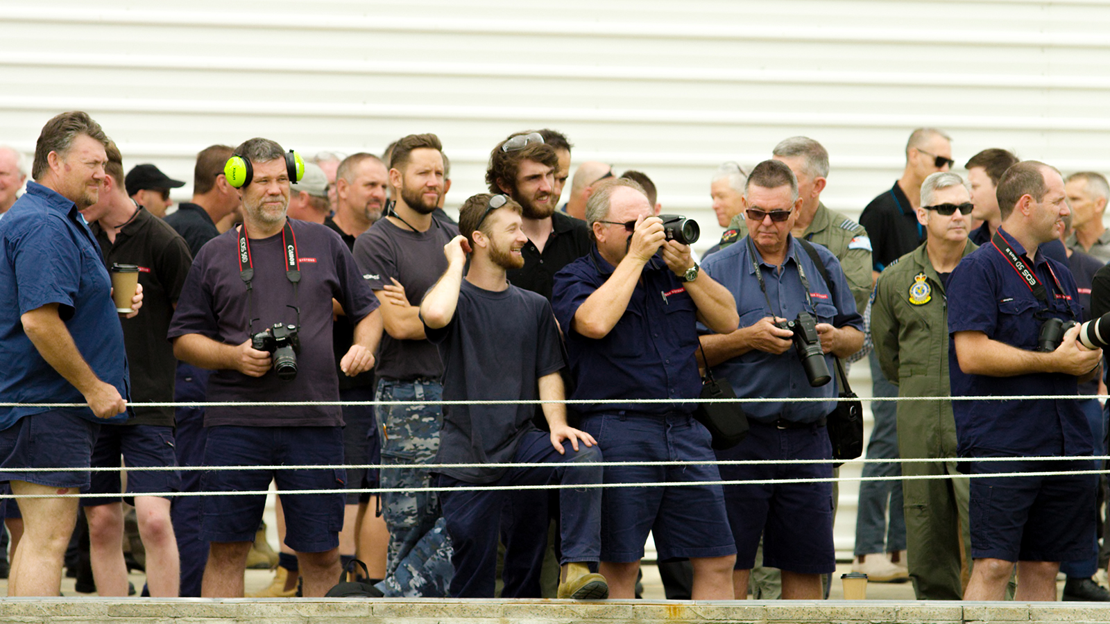 Onlookers as the first F-35 aircraft arrives at RAAF Base Williamtown.