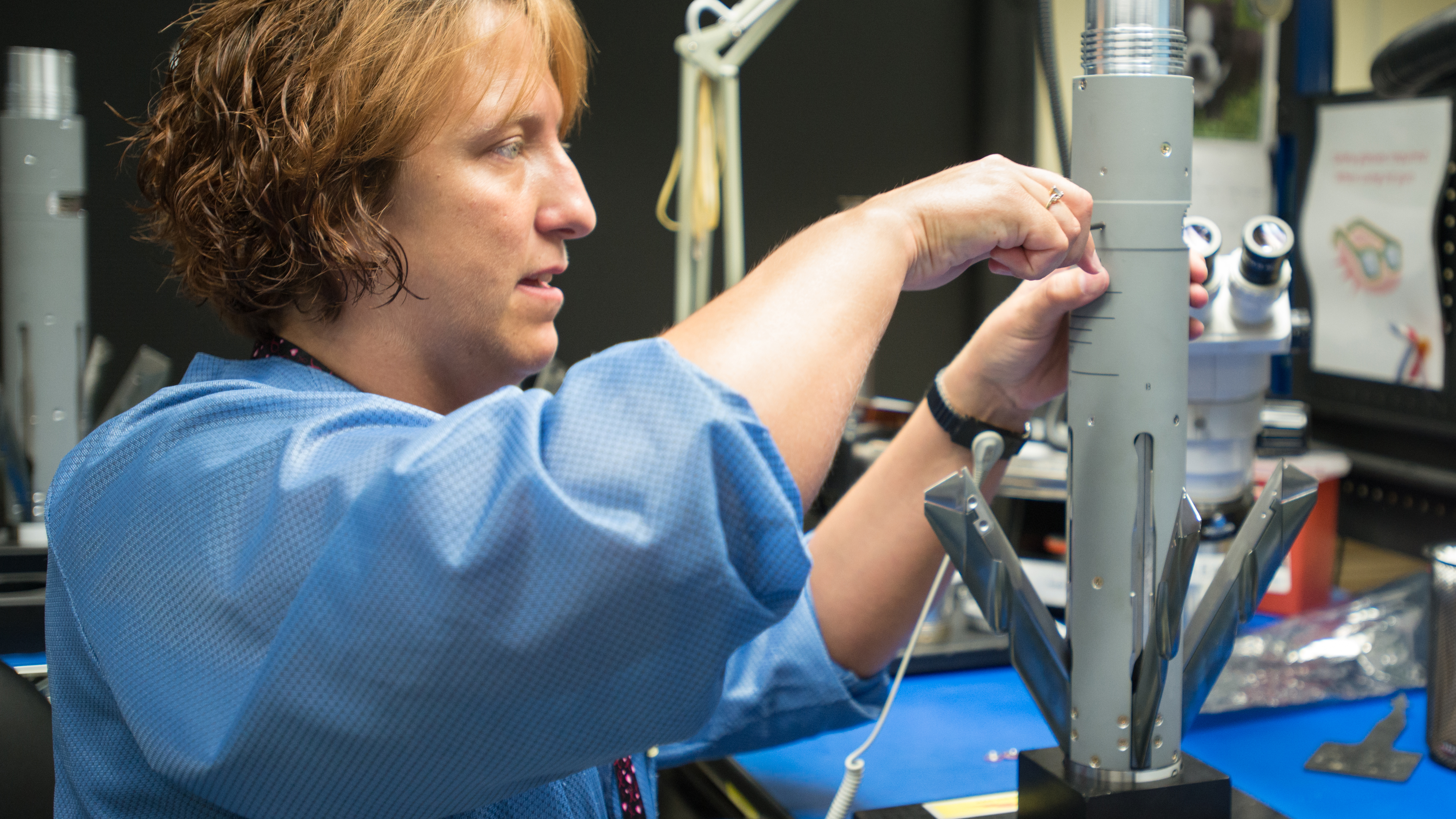 A production worker assembles the mid-body guidance on an APKWS™ laser-guided rocket