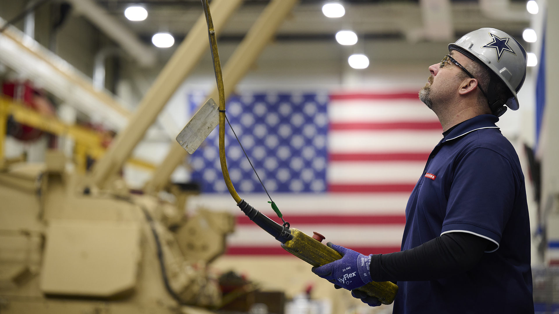 U.S. BAE Systems employee operates the crane in the M88A3 prototyping facility in Sterling Heights, Mich.