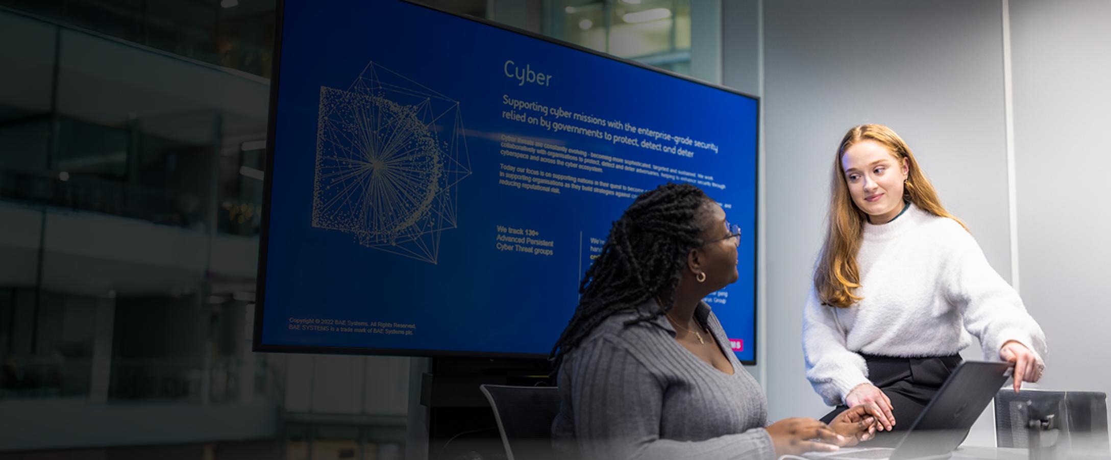 Female employee sitting on desk