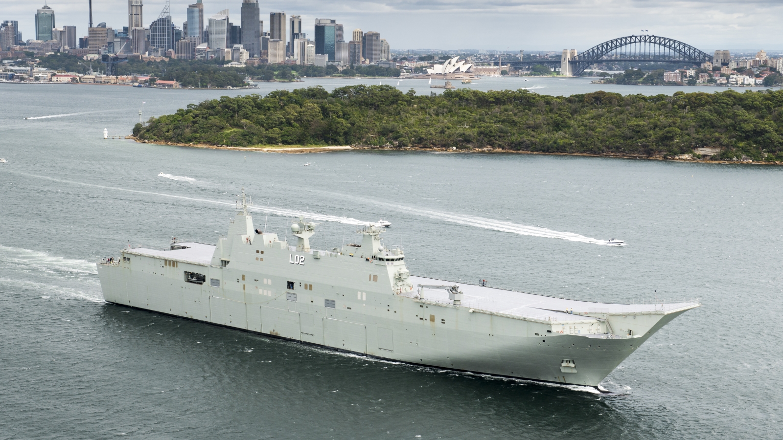 HMAS Canberra sails through Sydney Harbour