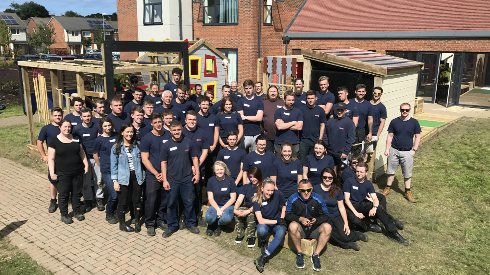 Apprentices and Graduates at the handover of the outdoor sensory play area to Grace House