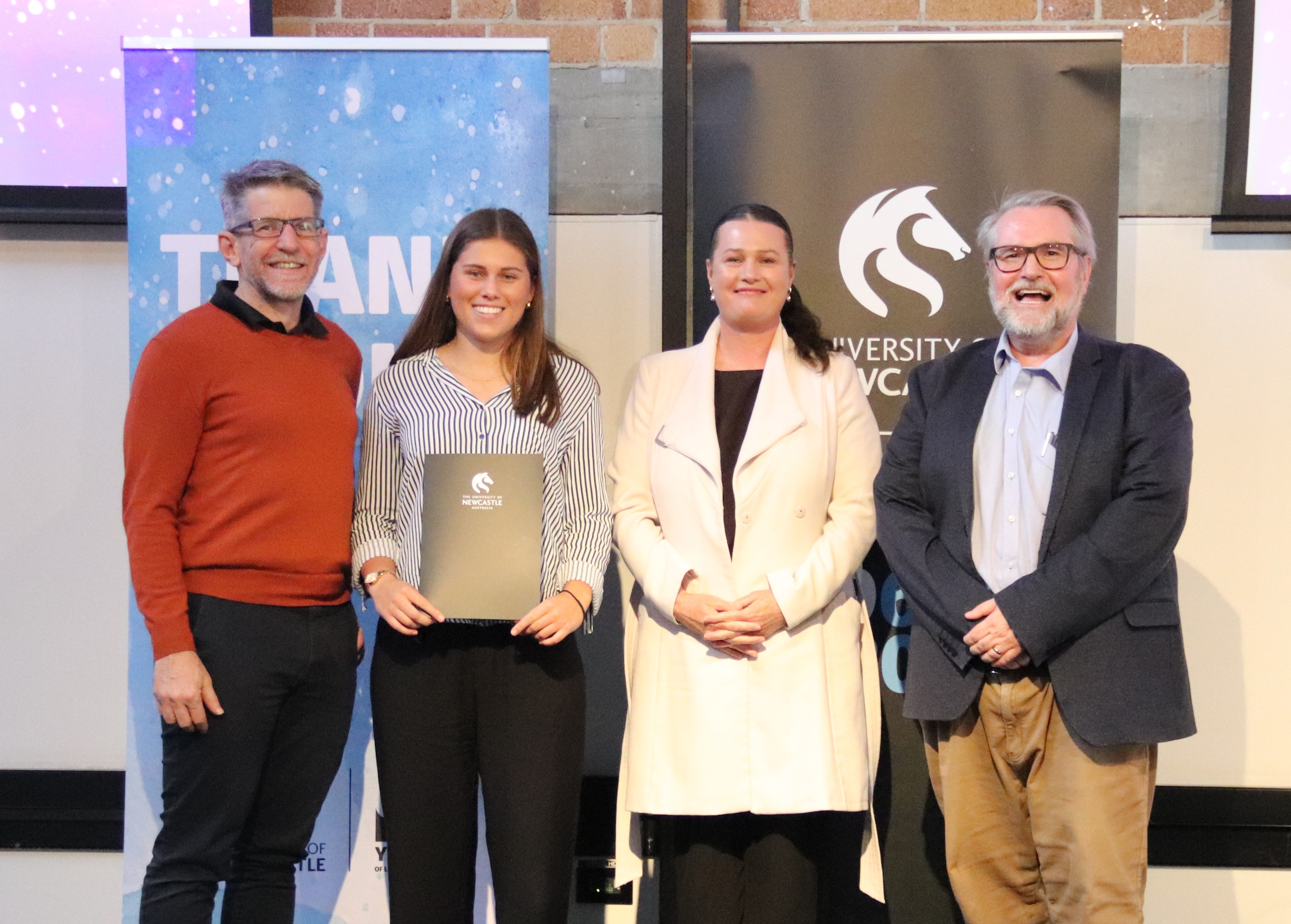 Imogen, Williams Hicks scholarship recipient, standing alongside BAE Systems and University of Newcastle staff