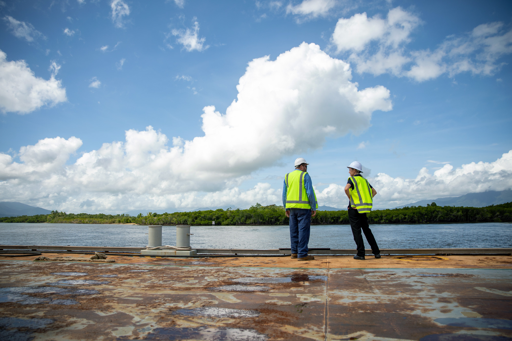 Two people looking out at the water at the Tropical Reef Shipyard in Cairns