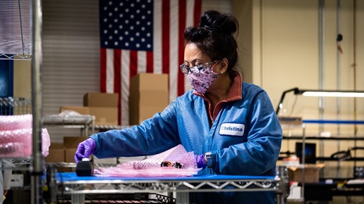 APKWS employee packages printed face shields in Hudson, New Hampshire.