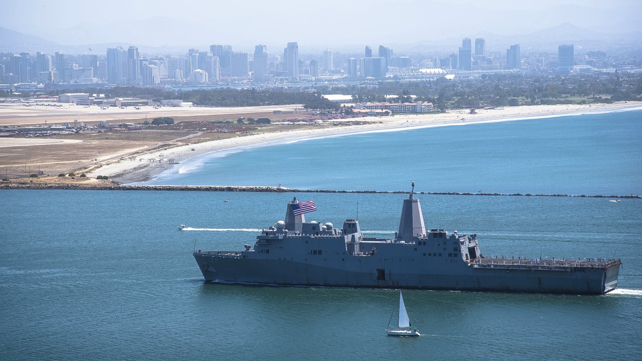 USS San Diego (LPD 22) returns to its namesake homeport of San Diego with the cityscape in the background. The amphibious transport dock ship will arrive in BAE Systems’ San Diego shipyard in September for maintenance and modernization. (U.S. Navy photo)