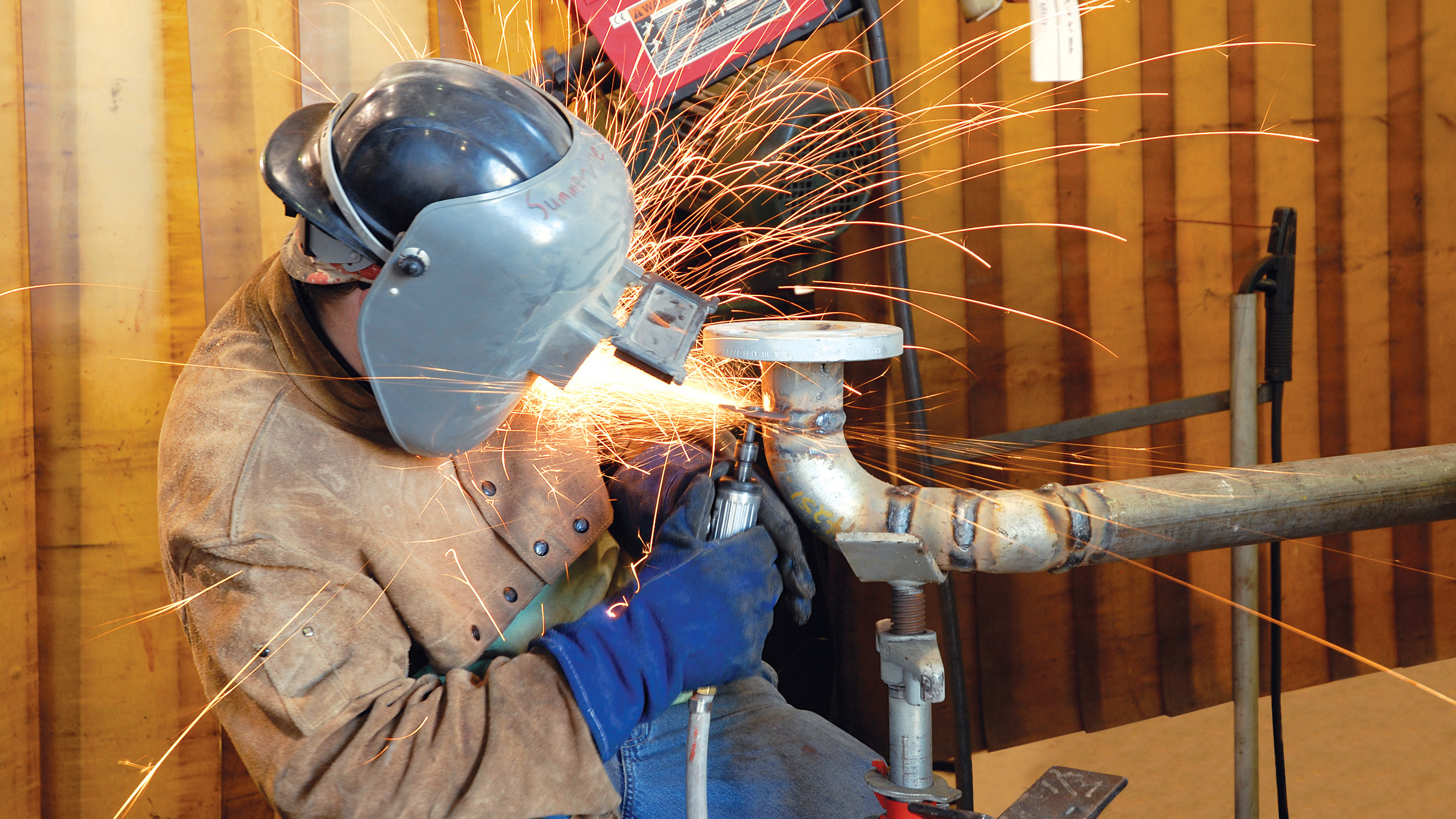 A focused welder in our BAE Systems Maritime Solutions Jacksonville business.