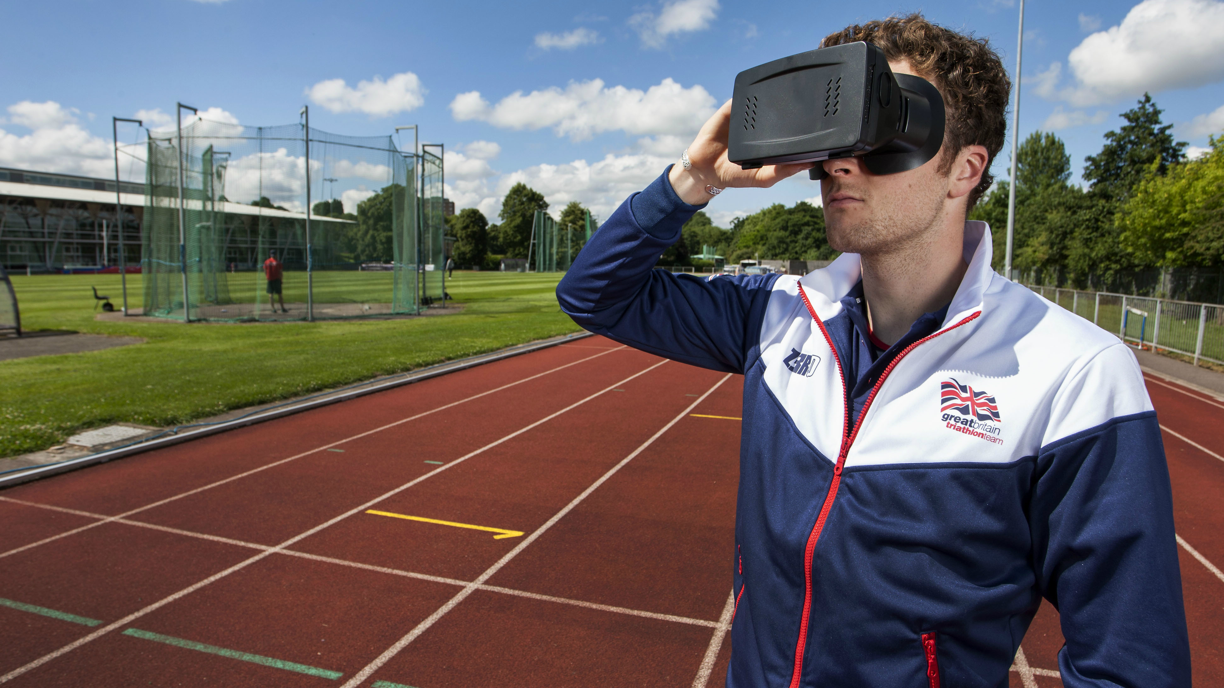 Athlete on track wears VR headset
