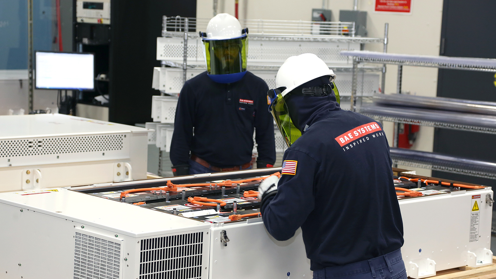 BAE Systems employees assemble energy storage systems in Endicott, NY.
