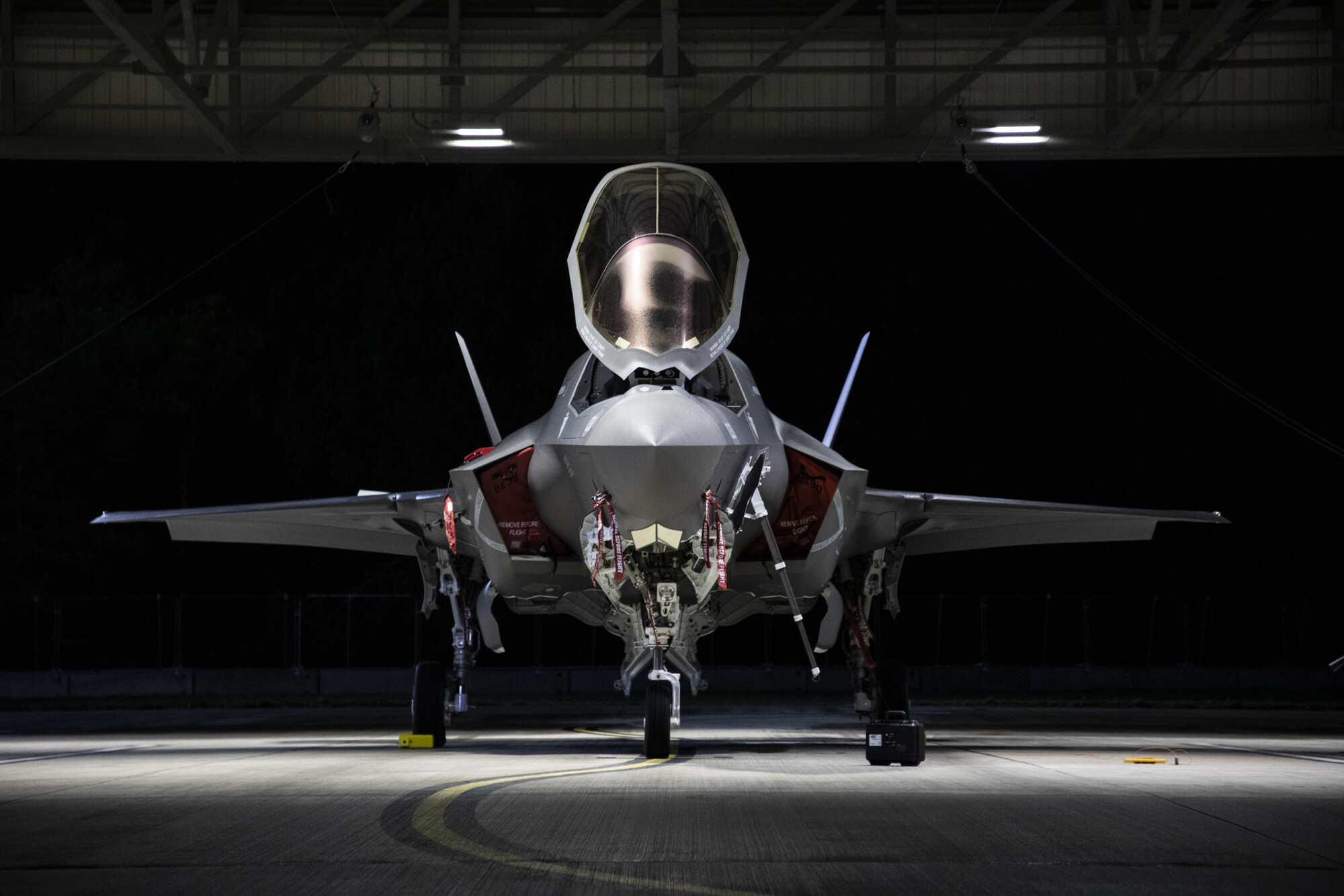 F-35 jet in a dark hangar at RAF Marham