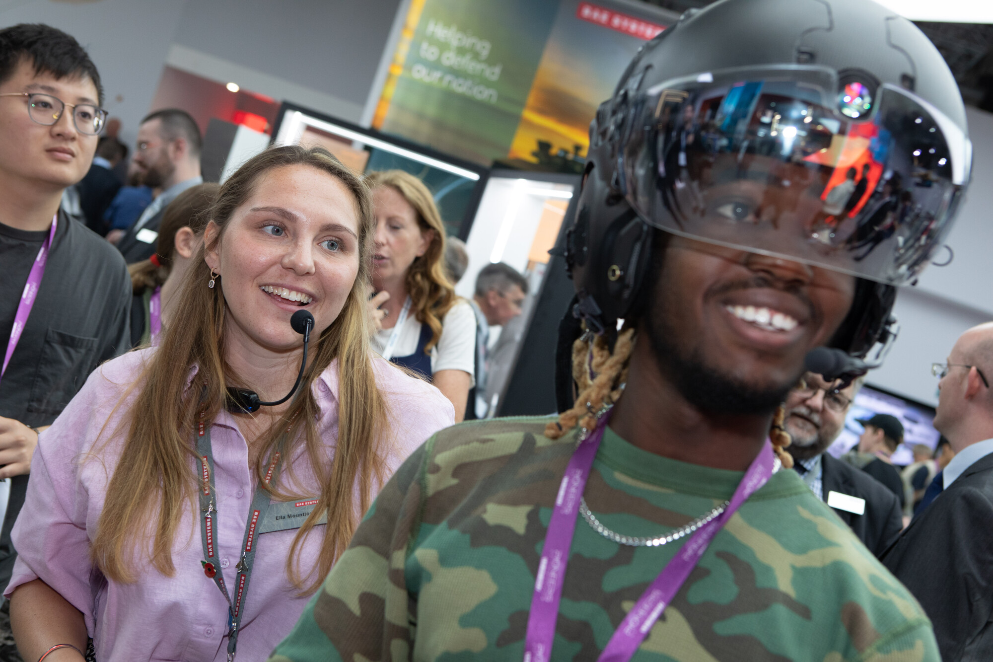 Employee showing robot quadruped to schoolchildren