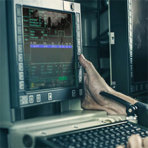 A hand on a computer