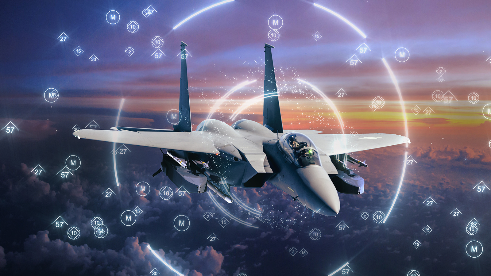 A Republic of Korea F-15K Slam Eagle flies above the clouds. An artist’s rendering of its electronic warfare capabilities overlays the image.