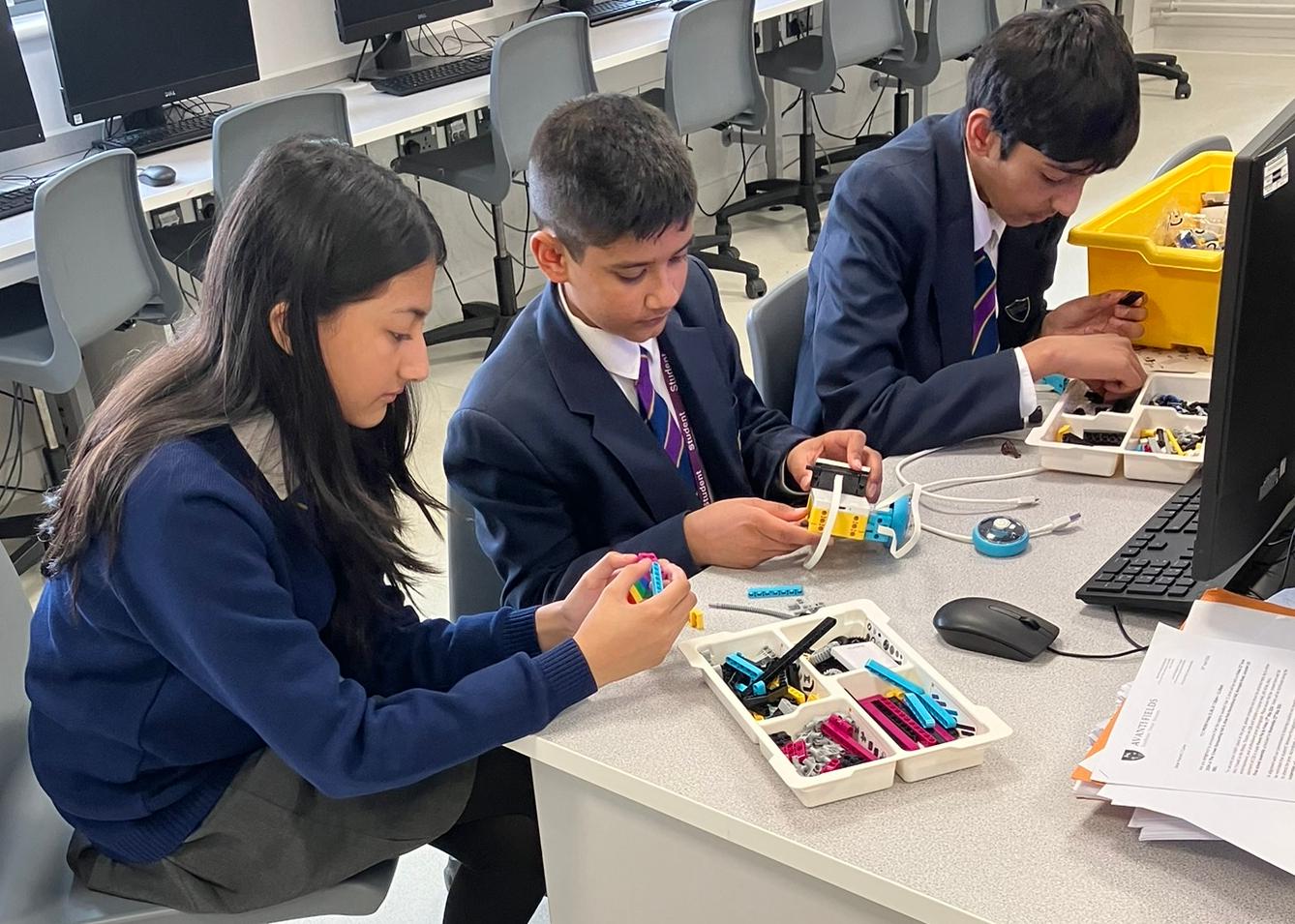 Students working together on a robotics activity in a classroom