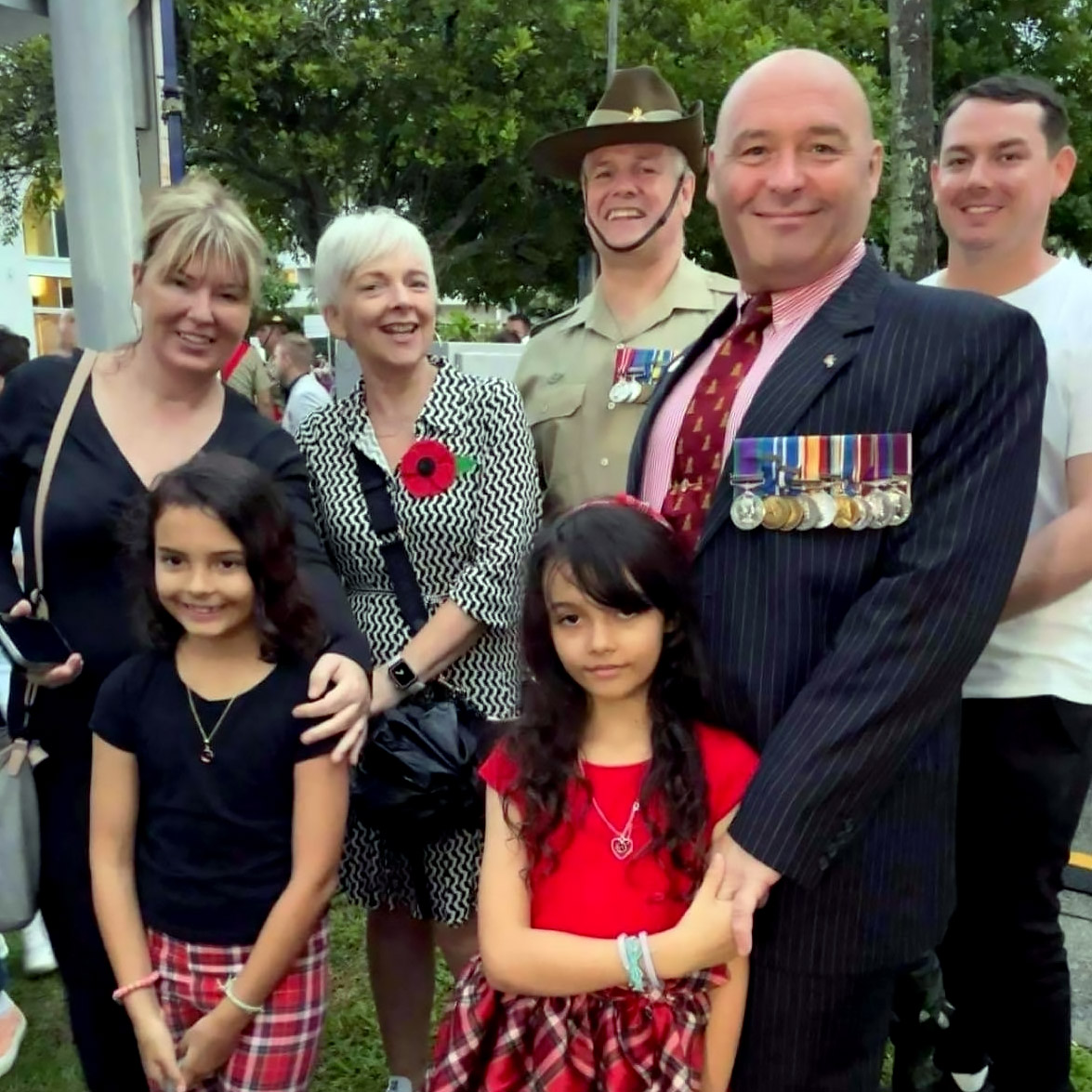 Legacy torch relay participant Drew at the Cairns Anzac Day service with families