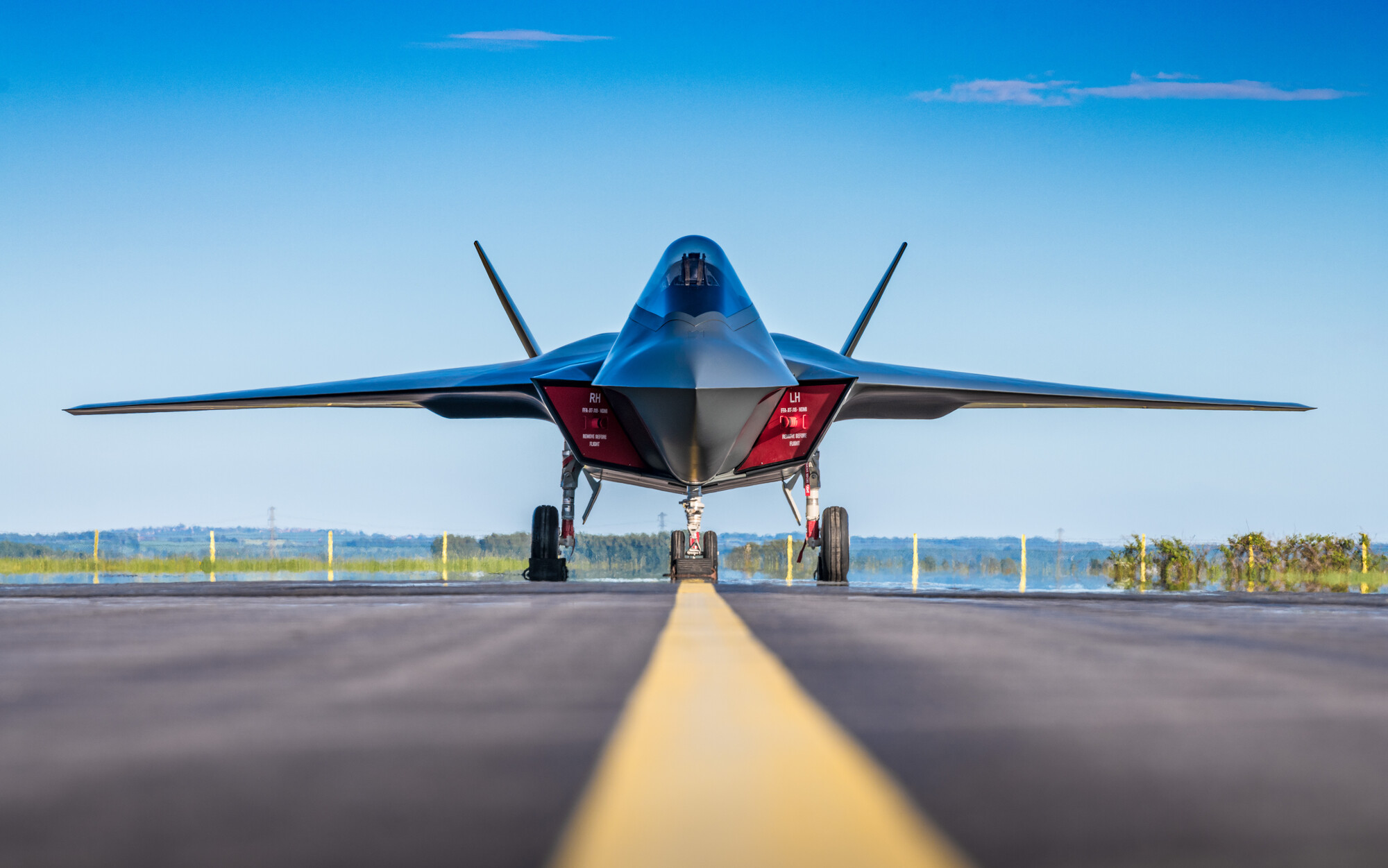 A Tempest jet on runway on a clear, blue sky day
