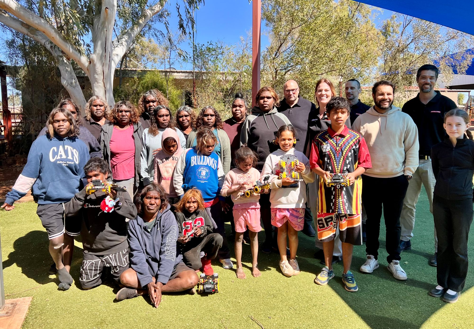 Group photo of the team and participants of the Beacon First Nations STEM education program across remote Northern Territory