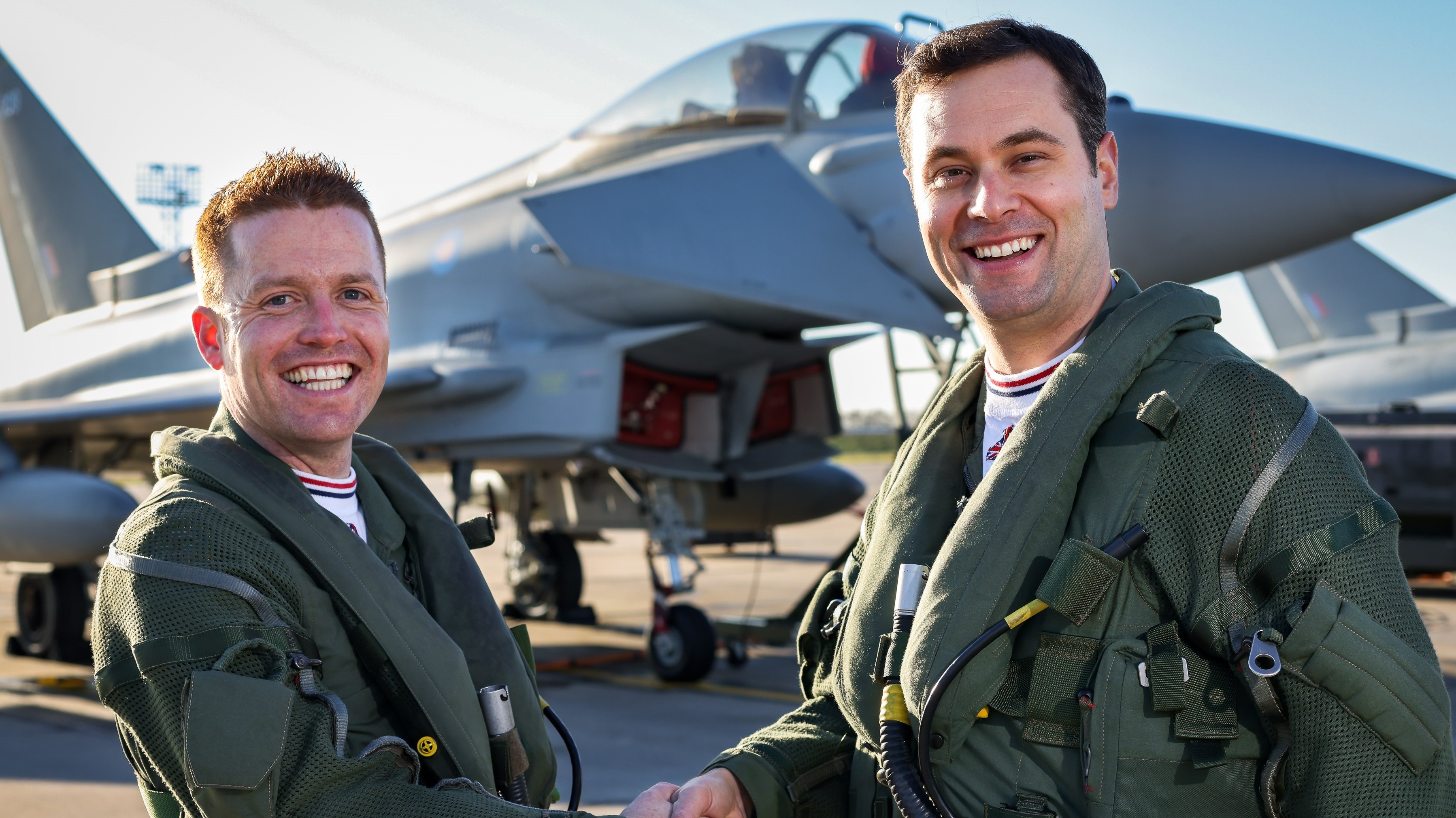 Typhoon Display Pilot Matt Brighty shakes hands with 2022 display pilot Paddy O'Hare.