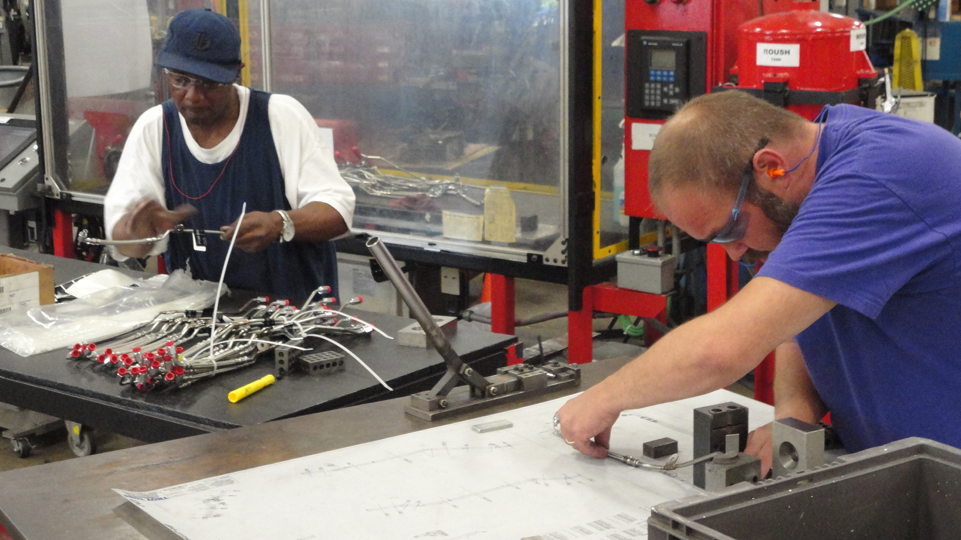 Troy Tube & Manufacturing employees work on parts used in the Bradley Fighting Vehicles.