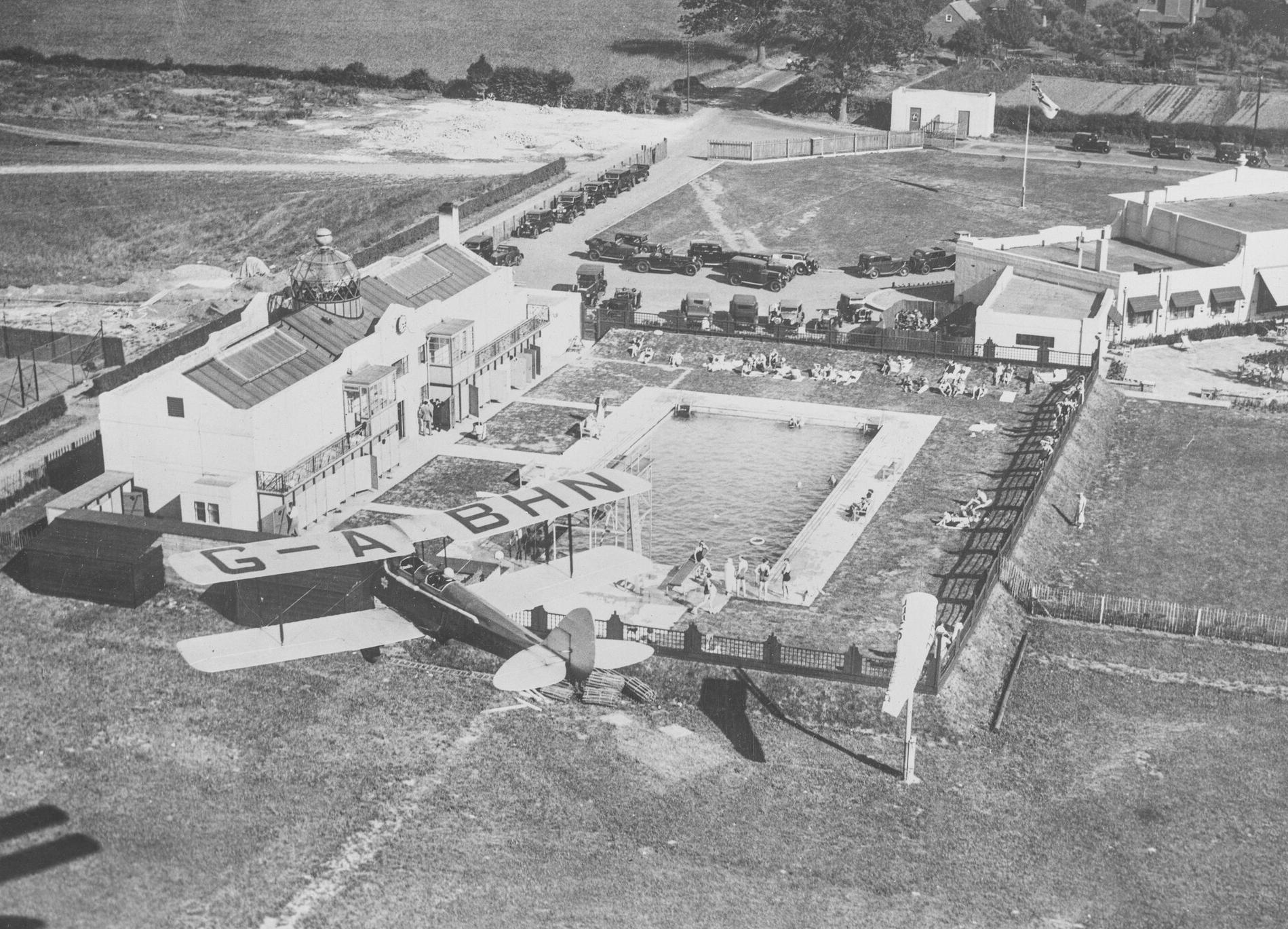 de Havilland DH60M Gipsy Moth (G-ABHN) flying over the de Havilland Aeronautical Technical School, Hatfield, c.1935.