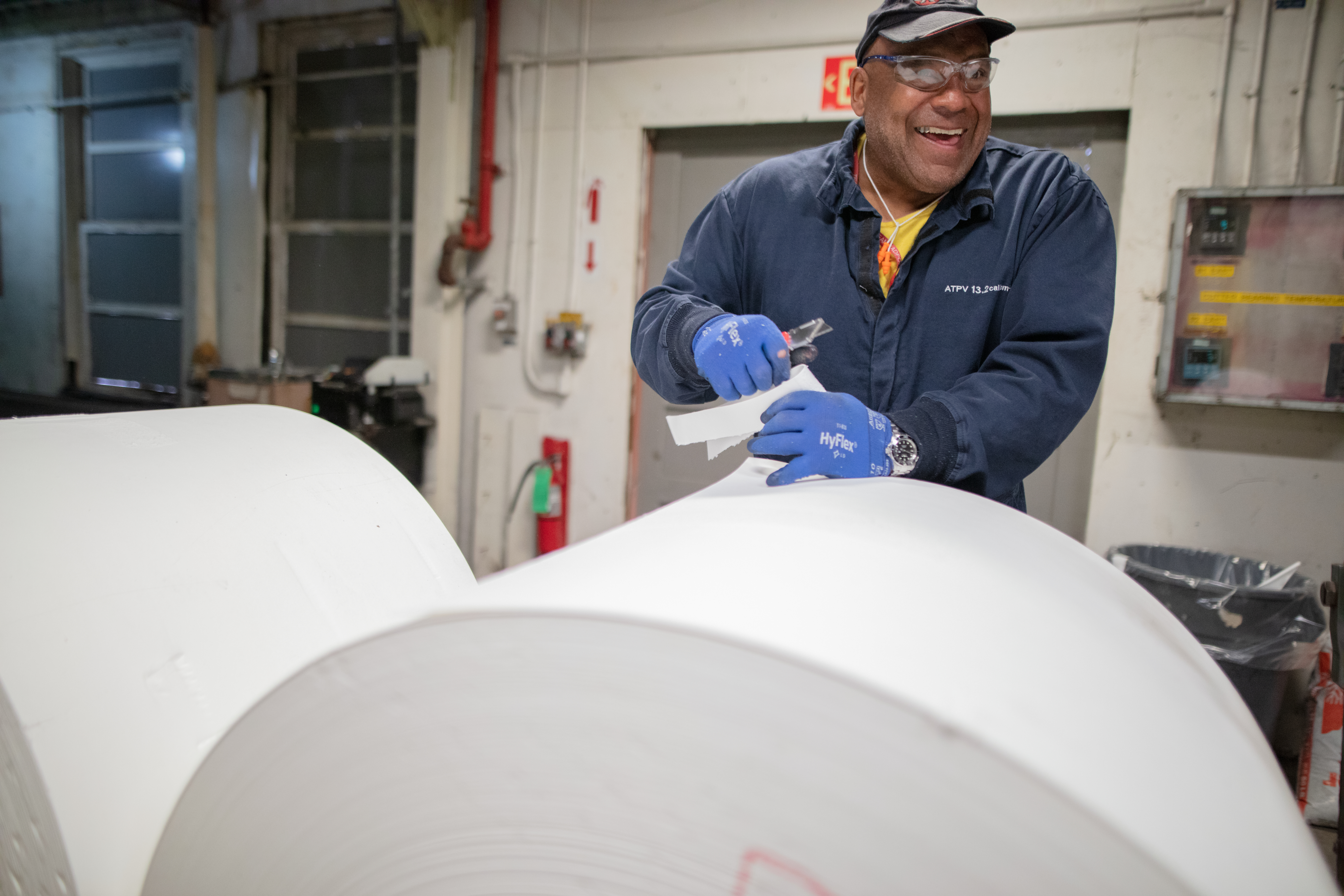 An employee smiles as he works