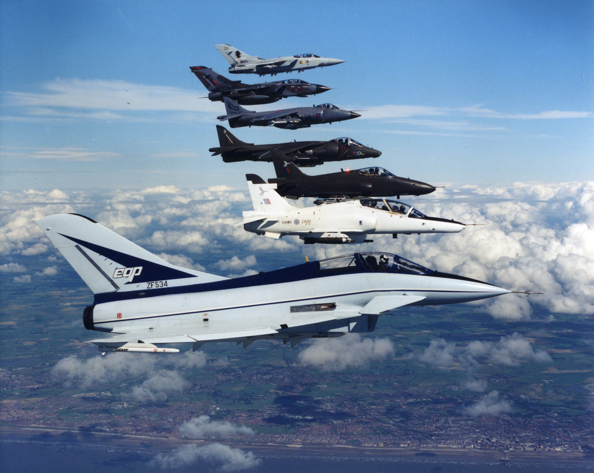 British Aerospace EAP (ZF534) in formation with other British Aerospace era aircraft including Hawk 100 (ZA101), G-Hawk, Hawk 200 (ZH200) and Harrier.