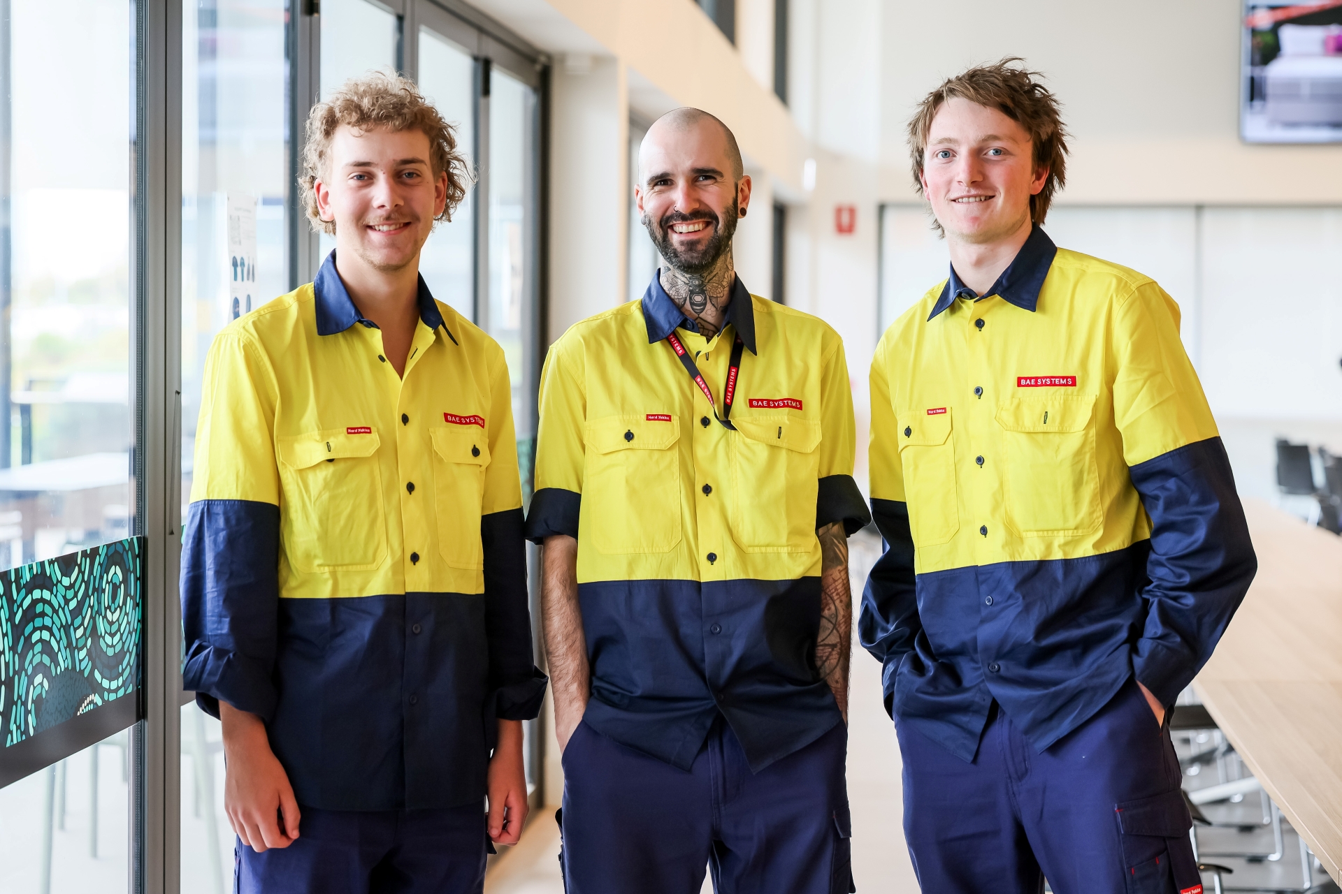 Two school leaver apprentices with mature-aged apprentice