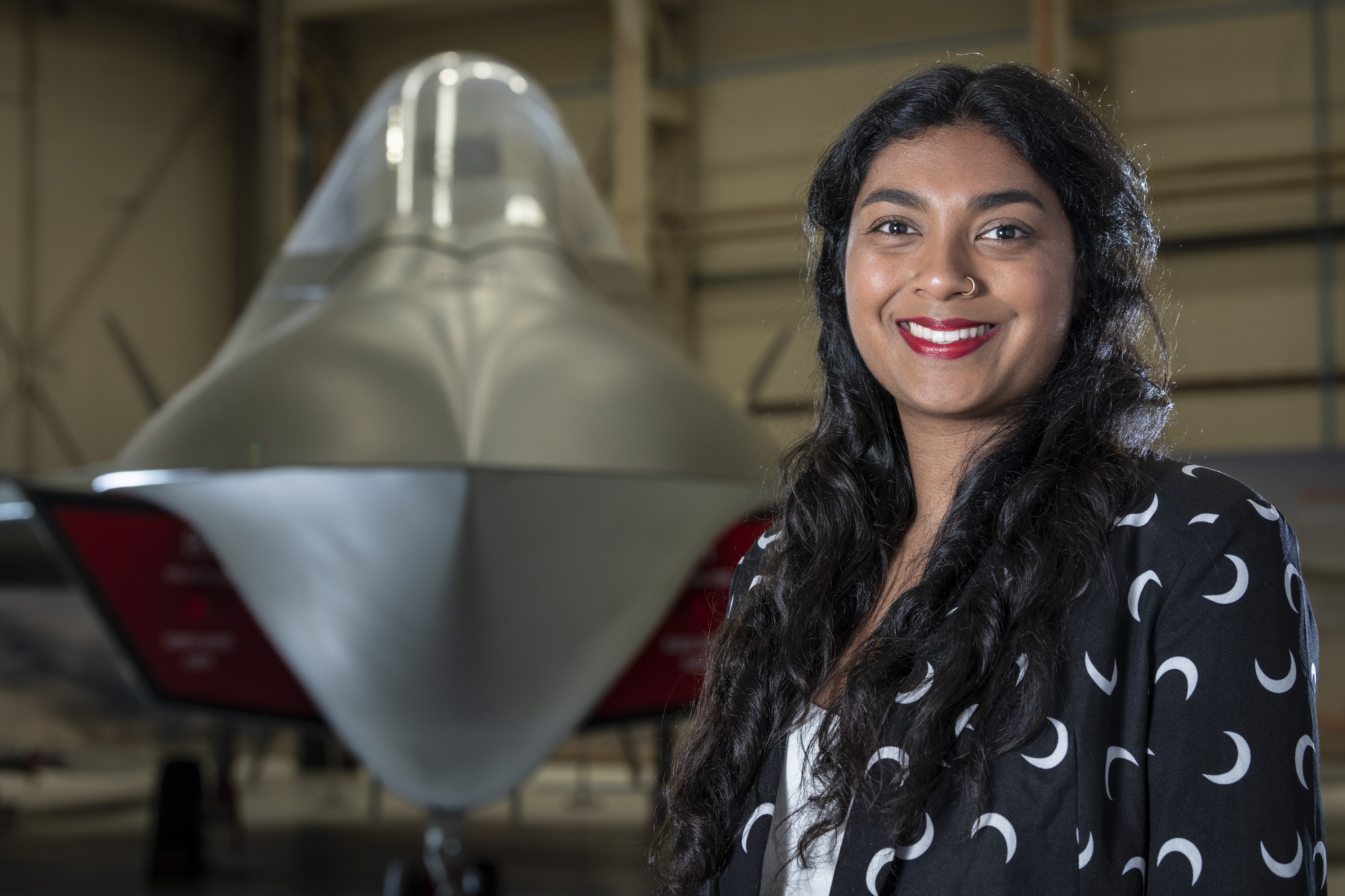 Krystina Pearson-Rampeearee in front of Tempest concept model