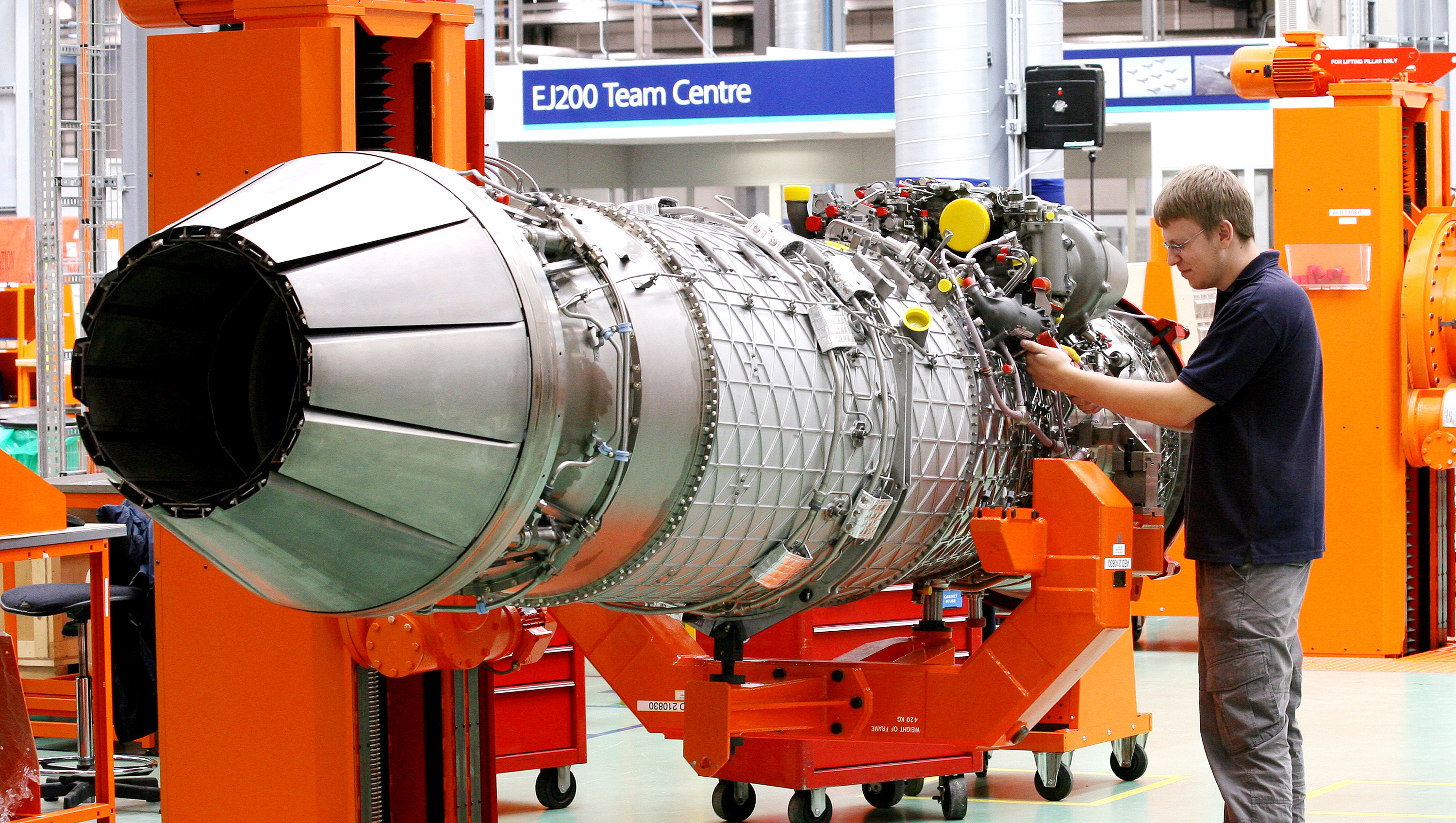 Rolls RoyceA worker with an EJ200 engine which powers the Eurofighter Typhoon at Rolls-Royce's factory in Filton, Bristol.