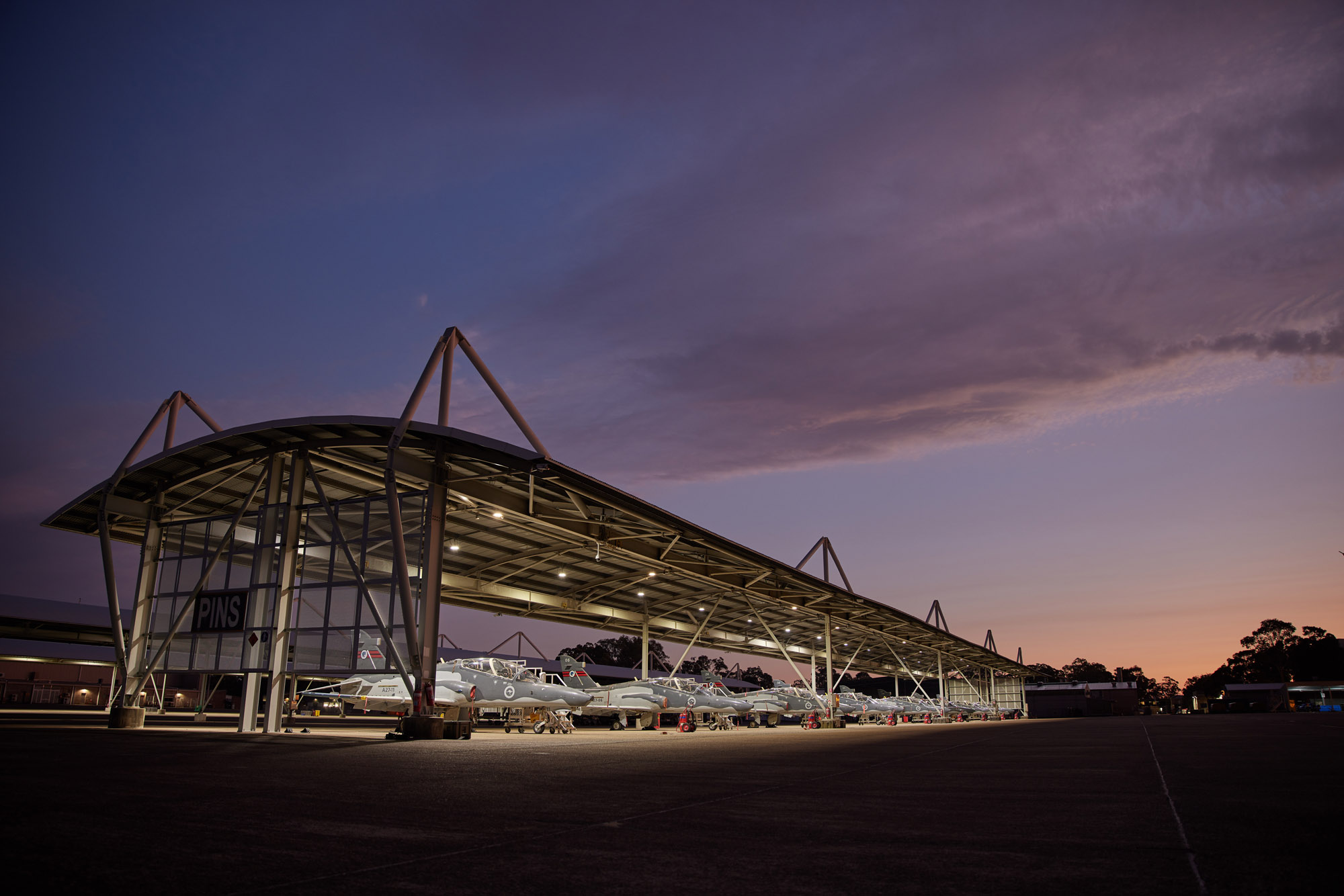 Sunrise photo of Hawk Lead-in Fighter aircraft in hanger