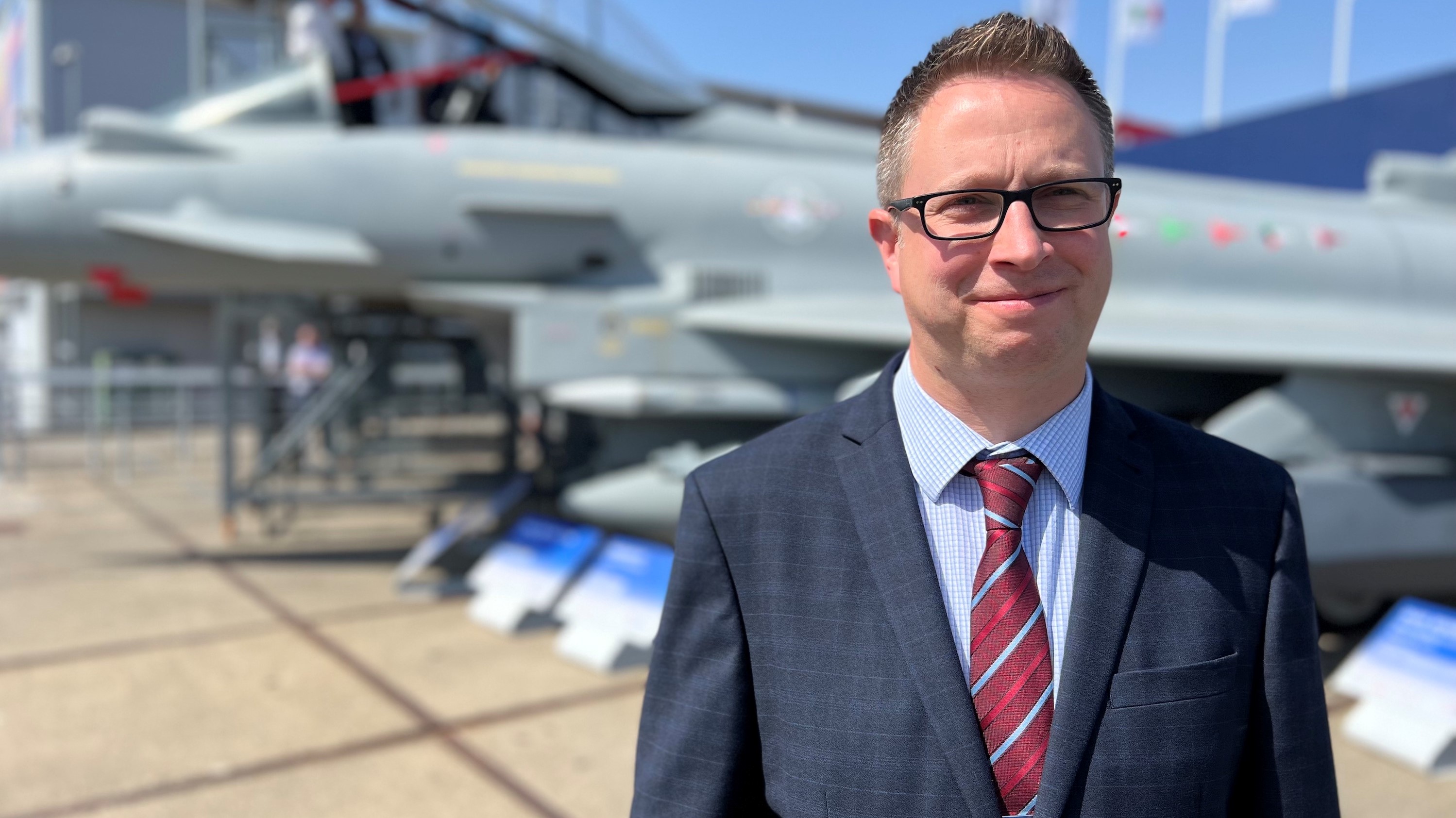 Nigel Kidd stood in front of a Eurofighter Typhoon jet